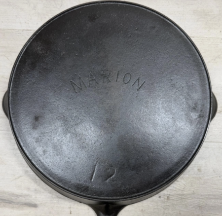 Bottom of antique Marion cast iron skillet no. 12 with heat ring. Sold for $500. 